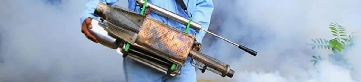 Fumigation technician using a fogger for deep pest treatment in Colorado Springs, CO
